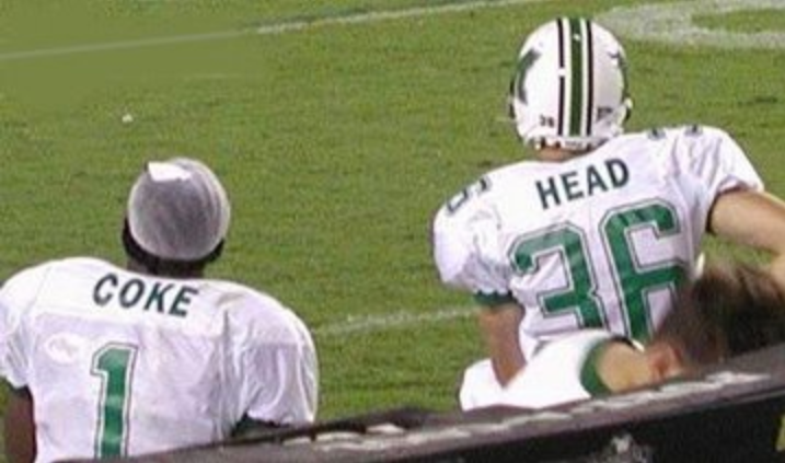 Marshall linebacker Gladstone Coke and Senior kicker Curtis Head enjoying the Thundering Herd game back in 2002.