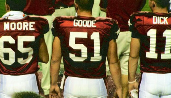 Arkansas Razorbacks Clarke Moore, Brett Goode, and Casey Dick hanging out on the sidelines.